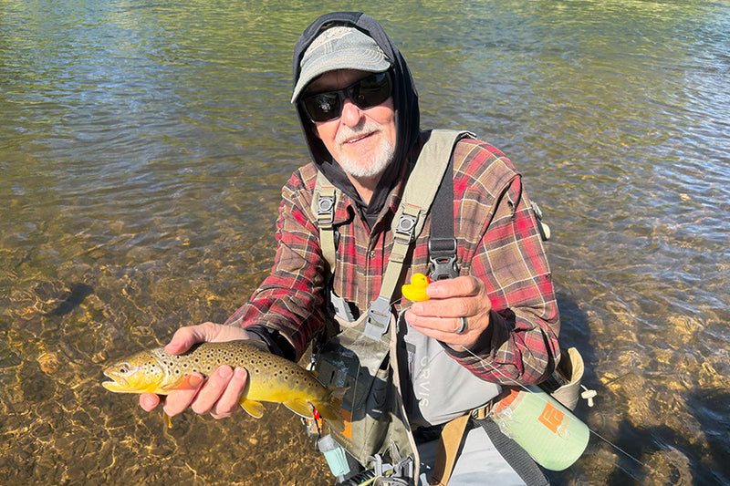 Bryan, Cofounder of Ducky Bobber, showing off a fish he caught using a ducky bobber.